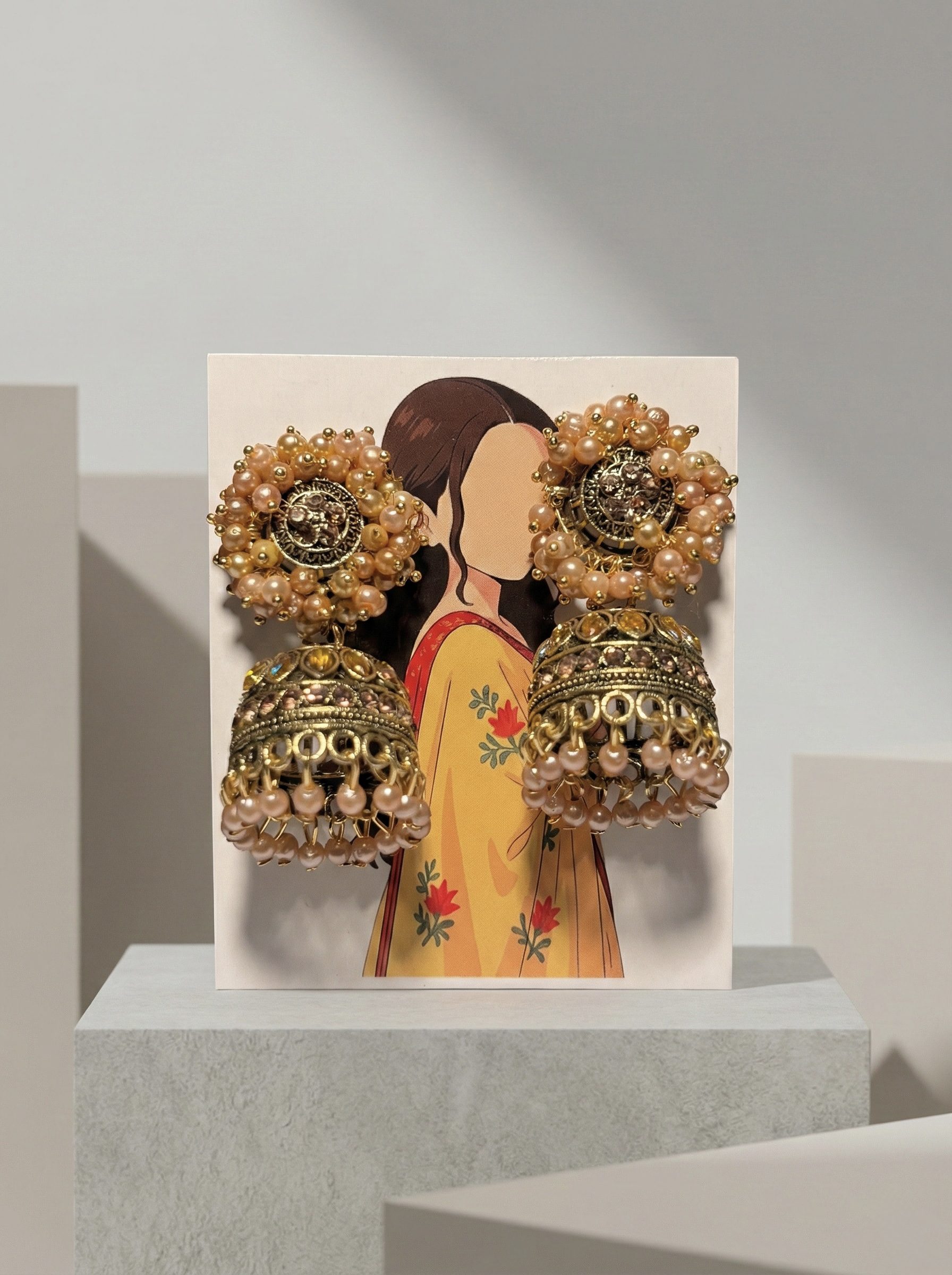 Antique Gold-Toned Traditional Jhumka Earrings with Peach Bead Clusters and Crystal Accents