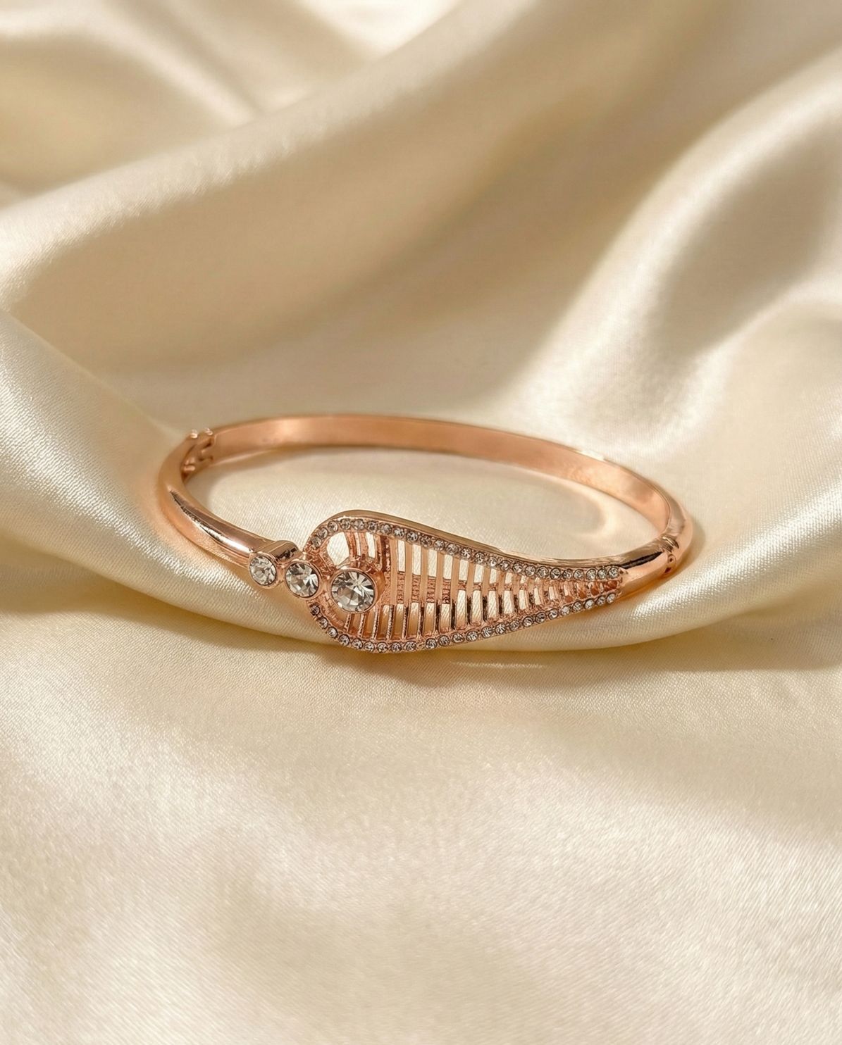 Rose Gold Toned Intricate Leaf Motif Bangle Bracelet with Crystal Embellishments